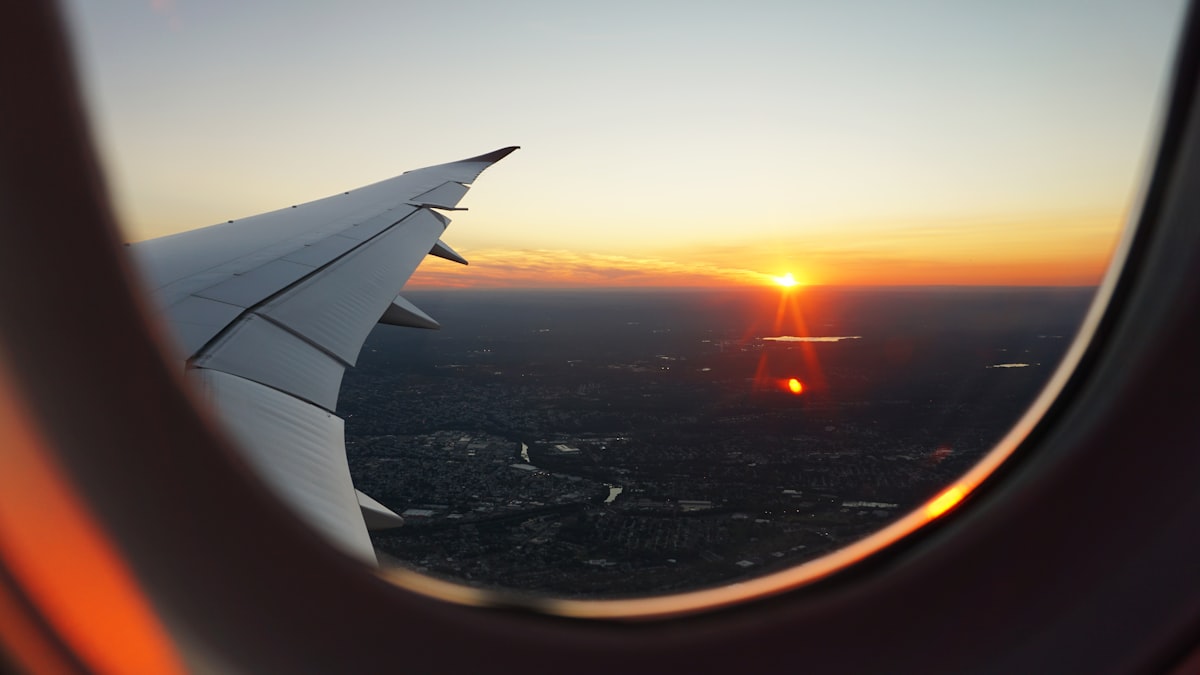 Traveler looking out an airplane window